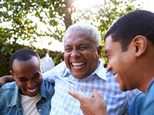 Dad with his two sons laughing
