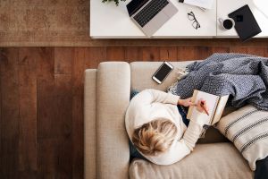 showing a person working remotely alone at home