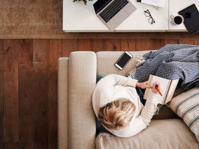 showing a person working remotely alone at home