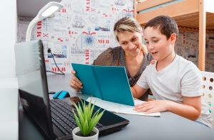 showing a mother and child working on homework