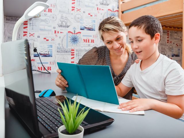 showing a mother and child working on homework