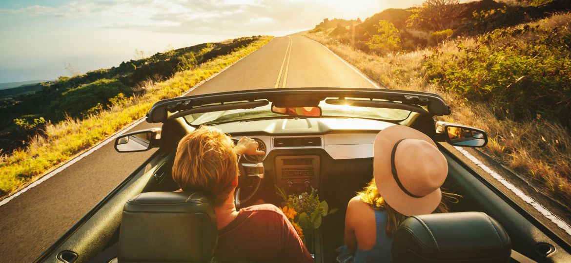 image of young couple on road trip