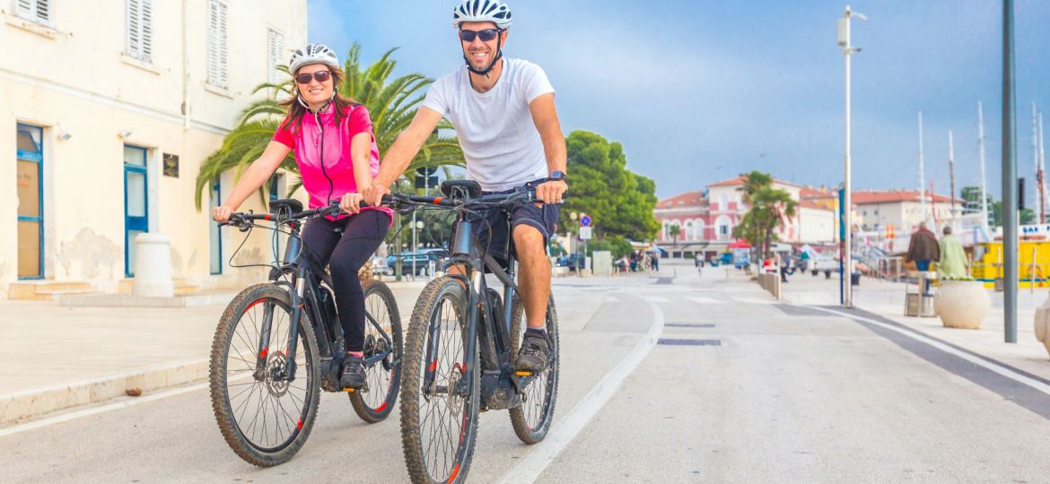 couple riding e-bikes