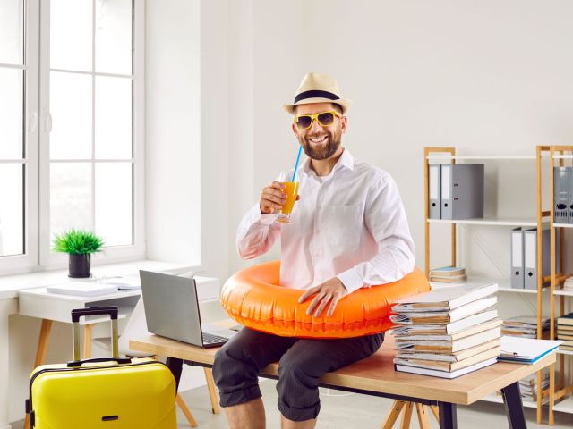 Funny office worker ready to go on summer holiday.